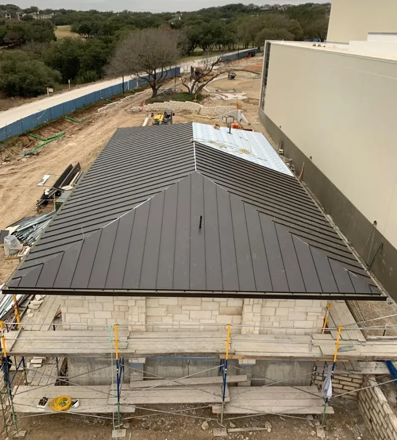 Metal roof new construction with scaffolding in Poland