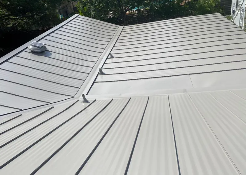 Solar attic fan installed on a metal roof for Roof Ventilation in Poland